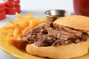 French dip sandwich with au jus sauce.