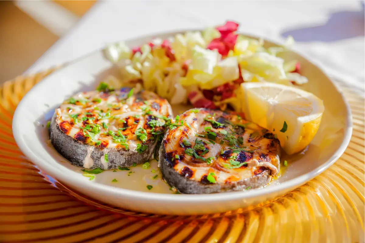 Grilled swordfish steak on a plate