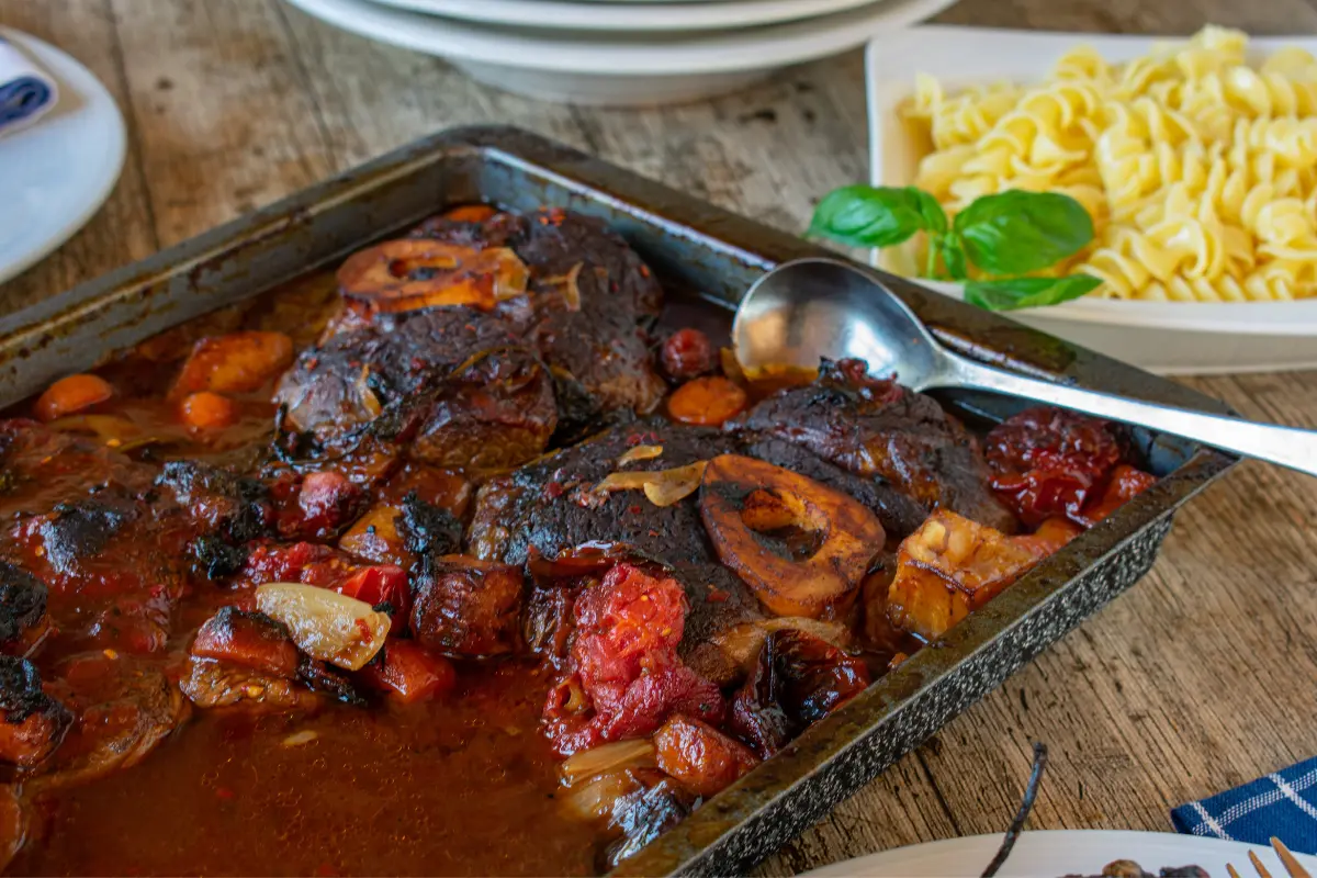 Classic Braised Beef Shank with herbs and vegetables. 