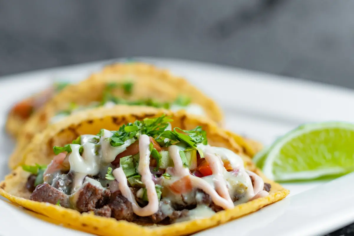 Homemade Honduran Baleadas with refried beans, avocado, and cheese.