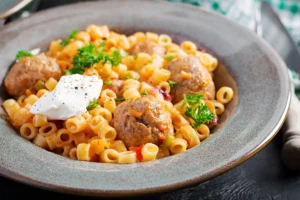 Bowl of Ditalini Pasta with Bacon, Peas, and Parmesan