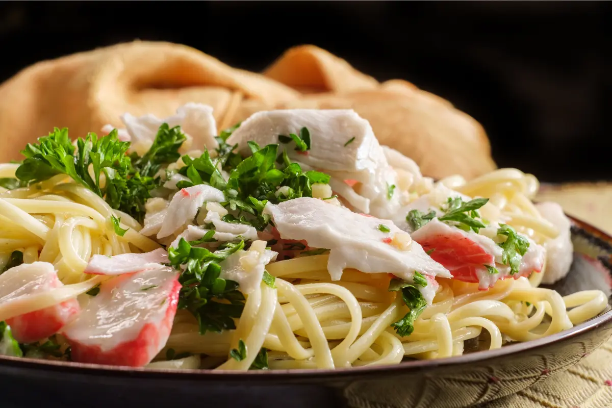 Variety of dishes made with imitation crab, including salads and dips.