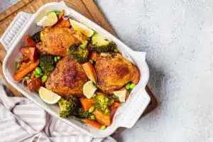 Golden-brown Polish roasted chicken with vegetables.