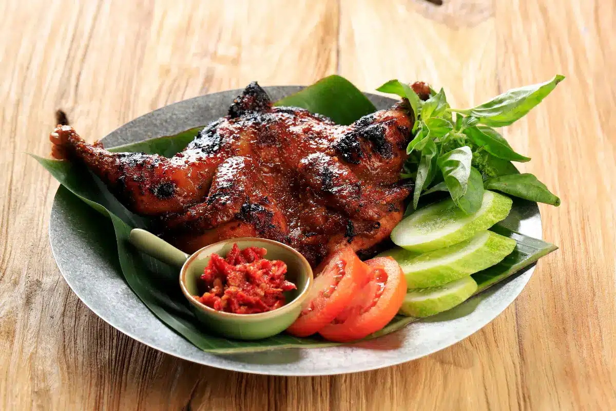 Golden-brown Polish roasted chicken with vegetables.
